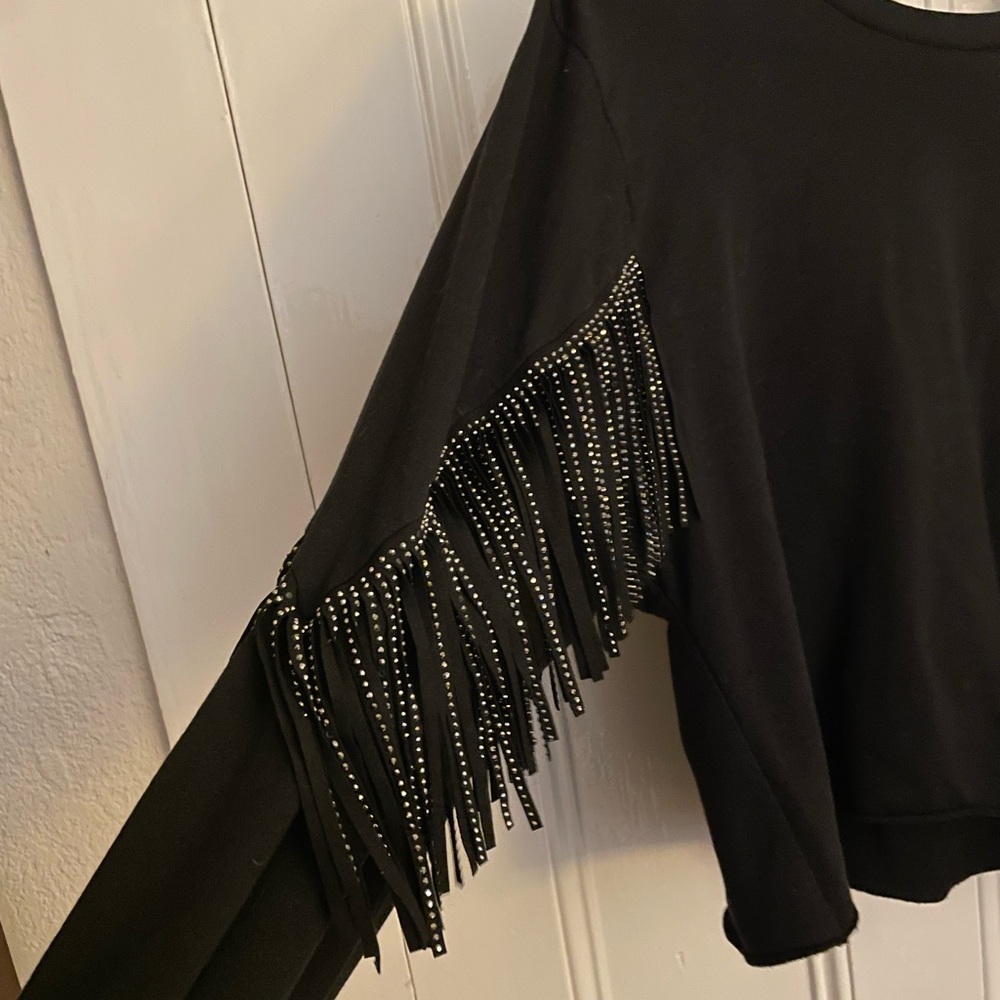 Young Fabulous and Broke sweatshirt style top with sequin arms.